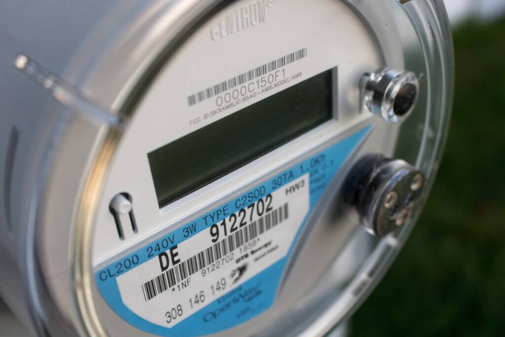 Close-up of an electrical meter tracking solar energy usage for Net Metering in New Jersey.