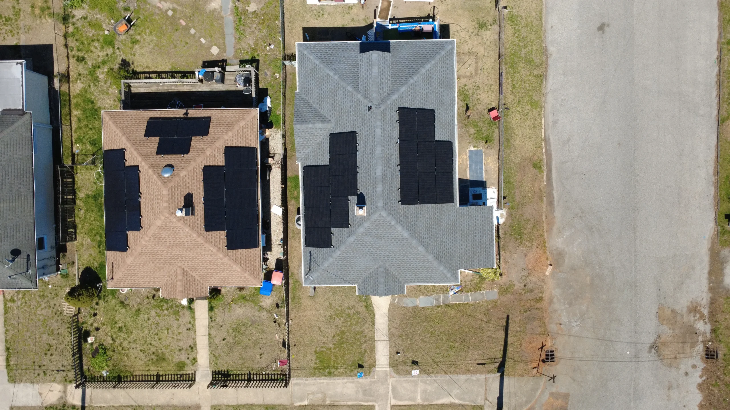 Aerial view of new roof replacement with solar panel installation in New Jersey